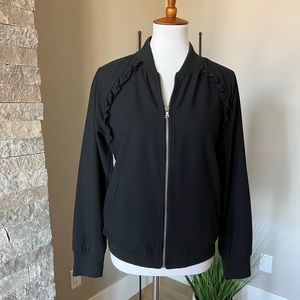 Single layer jacket with cute ruffle detail. Worn only a few times.